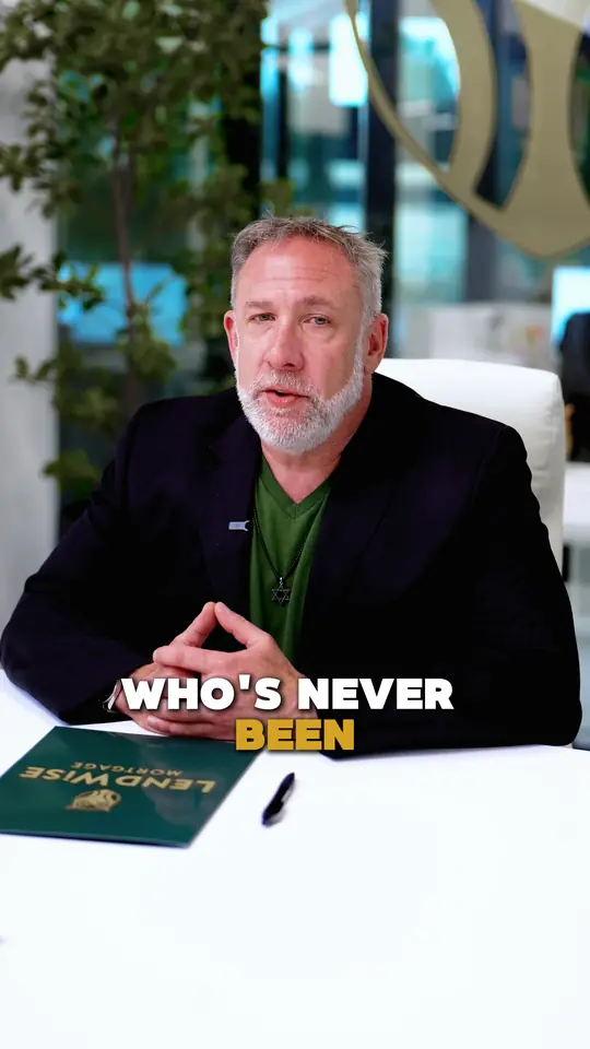 A loan officer at the studio desk