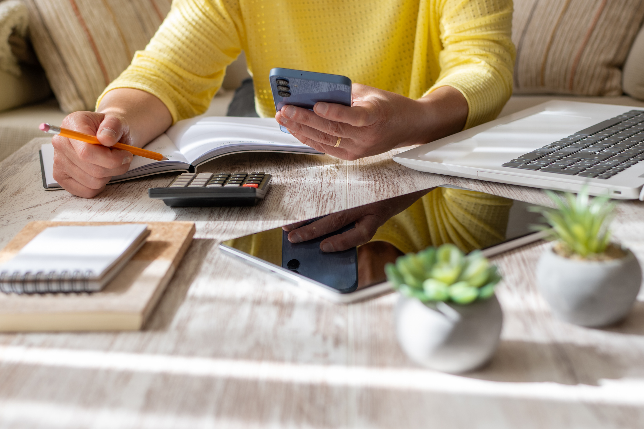 A calm desk set up for planning a first home purchase